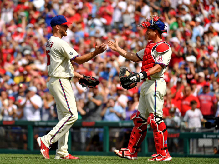 Aug 8, 2021; Philadelphia, Pennsylvania, USA; Philadelphia Phillies starting pitcher Zack Wheeler (45) and catcher J.T. Realmuto (10) celebrate win against the New York Mets at Citizens Bank Park.